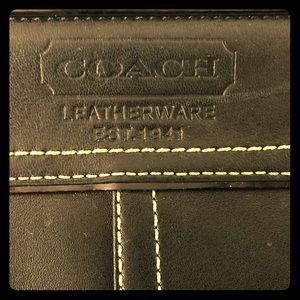 COACH wristlet in black, patent leather trim